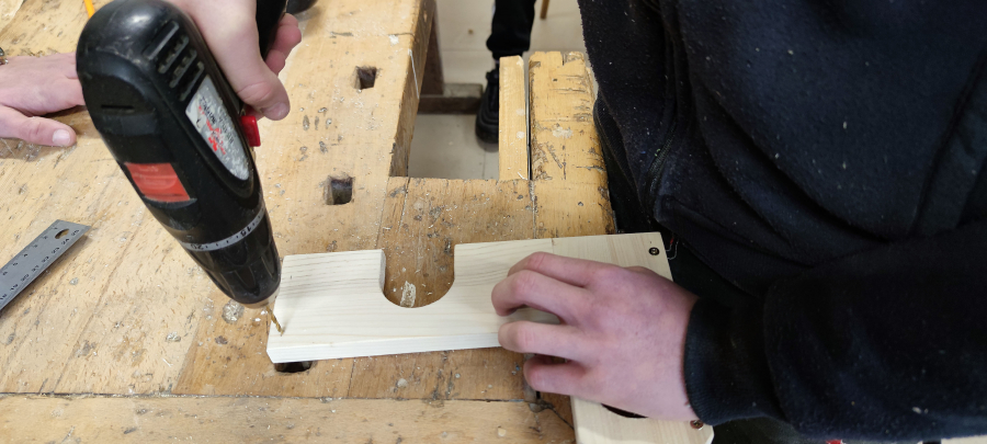 Carpenter preparing a wooden object
