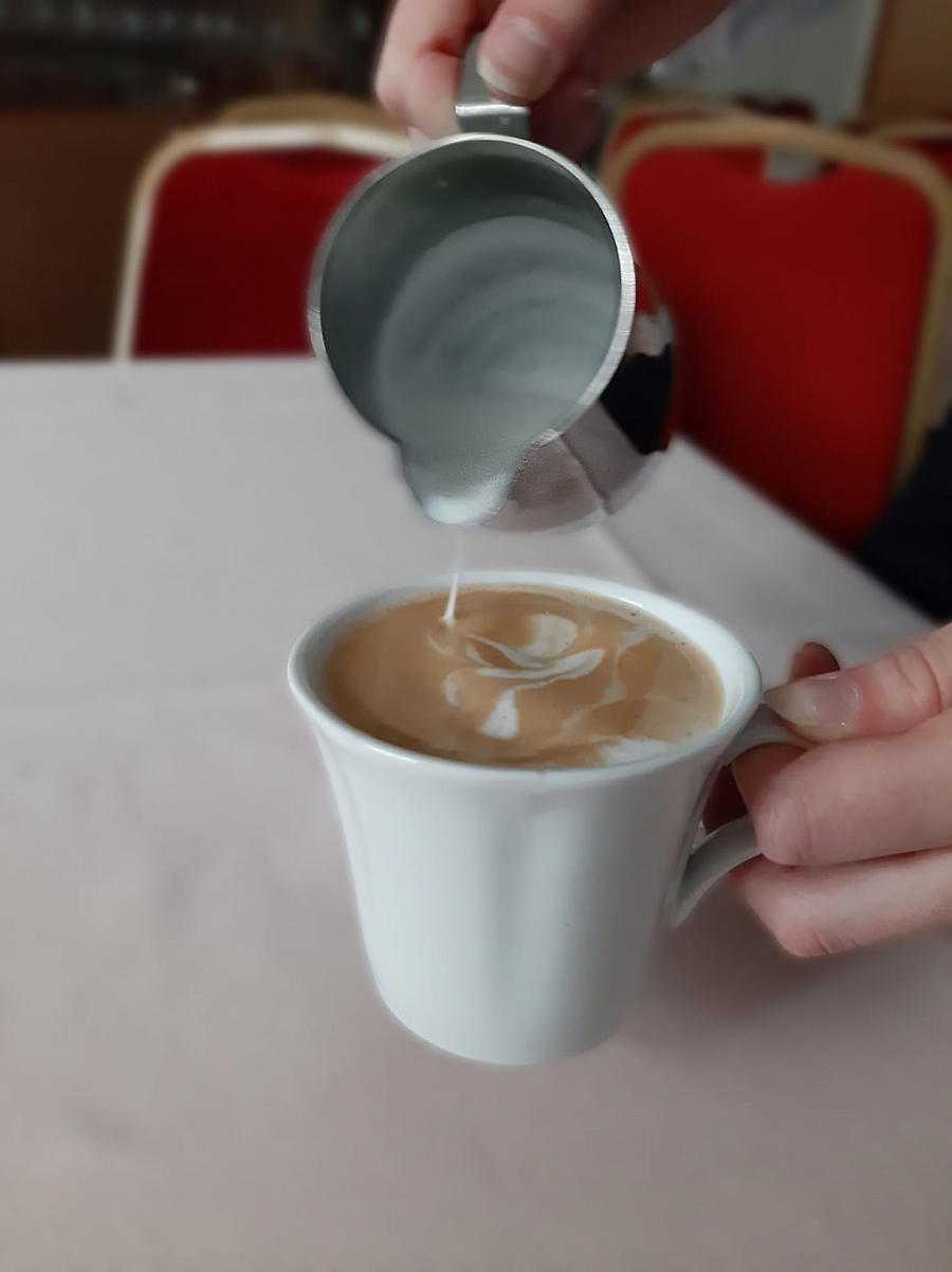 Close of pouring coffee in a cup